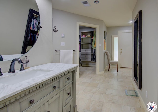 6 High Point Dr, Texarkana, TX 75503 - full bathroom featuring vanity, a walk in closet, and recessed lighting