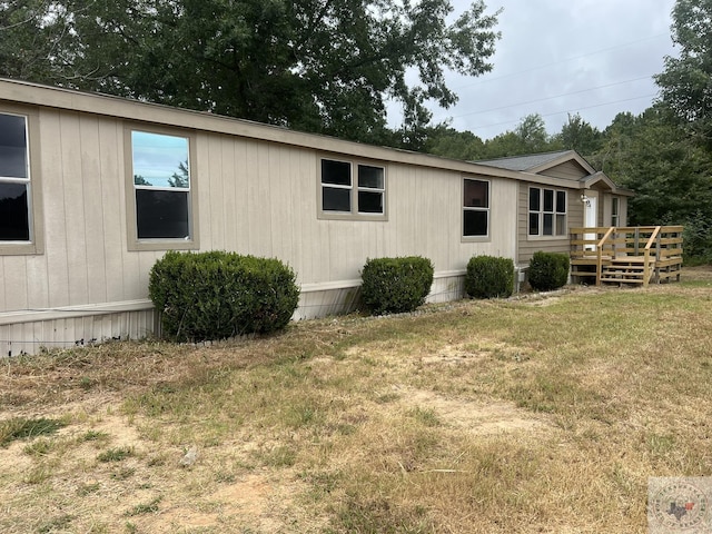 119 Krobot Cir, Texarkana, TX 75503 - view of property exterior with a wooden deck and a yard