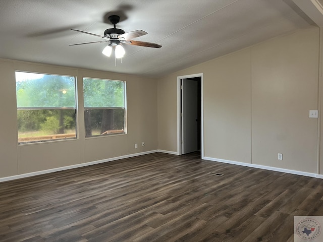 119 Krobot Cir, Texarkana, TX 75503 - spare room with vaulted ceiling, ceiling fan, and dark hardwood / wood-style flooring