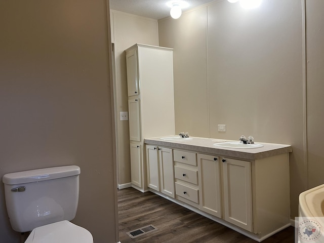 119 Krobot Cir, Texarkana, TX 75503 - bathroom with vanity, toilet, and hardwood / wood-style flooring