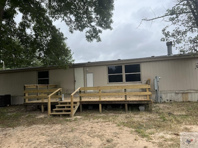 119 Krobot Cir, Texarkana, TX 75503 - rear view of house featuring a deck and central AC
