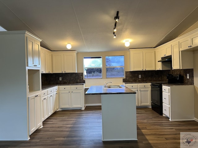 119 Krobot Cir, Texarkana, TX 75503 - kitchen with black electric range oven, sink, white cabinets, a kitchen island with sink, and dark hardwood / wood-style floors