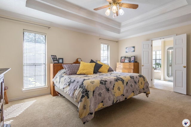 505 Langford Ln, New Boston, TX 75570 - bedroom featuring ornamental molding, a tray ceiling, light carpet, and ceiling fan
