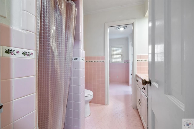 bathroom with crown molding, tile walls, tile patterned flooring, a shower with shower curtain, and vanity