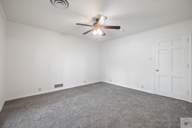 spare room with ceiling fan, dark carpet, and ornamental molding