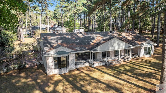 view of front facade featuring a patio and a front lawn