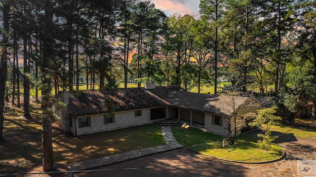 view of front of home with a yard