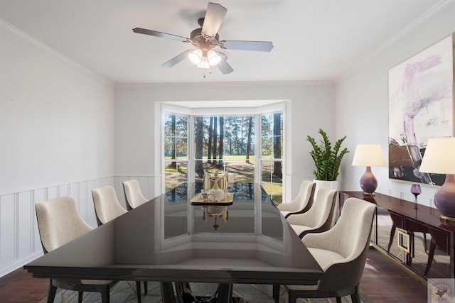 dining space with ceiling fan, crown molding, and dark hardwood / wood-style flooring