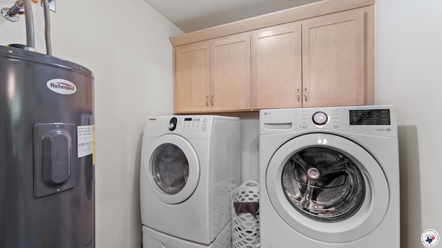 242 County Road 4228, Atlanta, TX 75551 - laundry room featuring water heater, washing machine and clothes dryer, and cabinet space