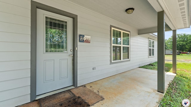 242 County Road 4228, Atlanta, TX 75551 - view of exterior entry with a porch