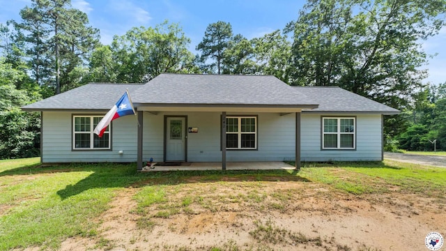242 County Road 4228, Atlanta, TX 75551 - single story home featuring a front lawn and a shingled roof