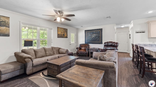 242 County Road 4228, Atlanta, TX 75551 - living area with a ceiling fan, dark wood-style flooring, ornamental molding, and recessed lighting