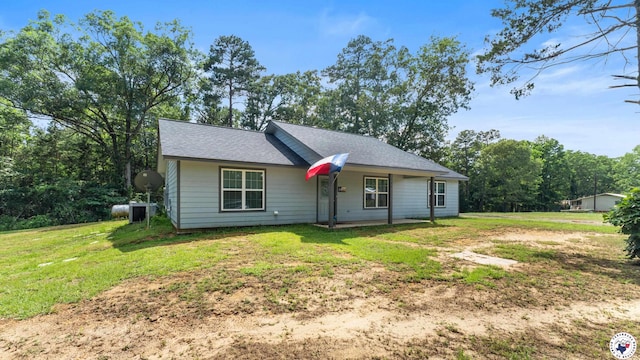 242 County Road 4228, Atlanta, TX 75551 - ranch-style home featuring a front lawn, central air condition unit, and roof with shingles