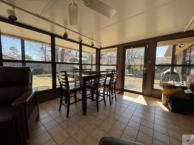 sunroom / solarium with ceiling fan