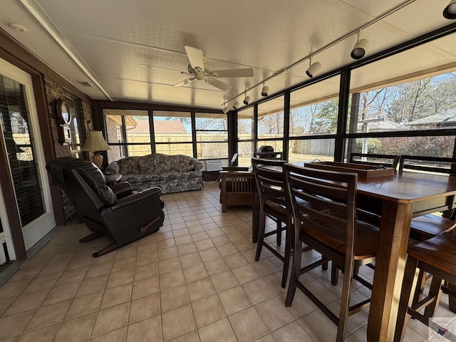 sunroom / solarium with ceiling fan and a wealth of natural light