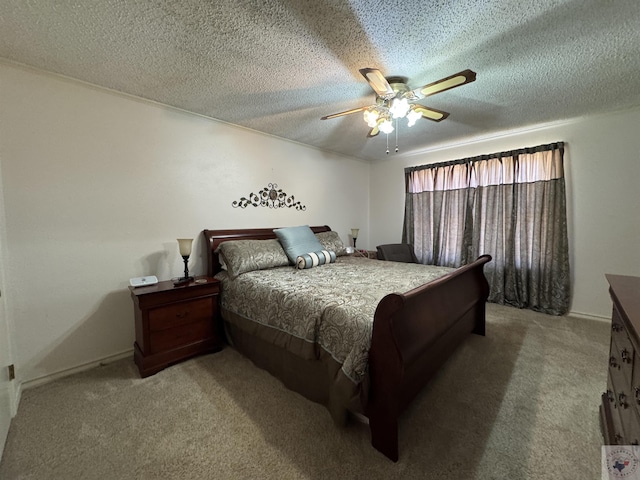 bedroom featuring carpet floors, ceiling fan, and a textured ceiling