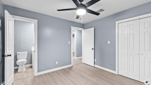 10 Vernon St, Hooks, TX 75561 - unfurnished bedroom featuring wood finished floors, a closet, ensuite bath, and a ceiling fan