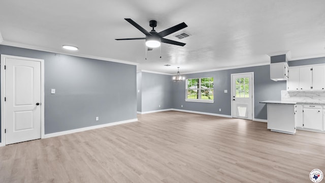 10 Vernon St, Hooks, TX 75561 - unfurnished living room with ornamental molding, a ceiling fan, light wood-style flooring, and a chandelier