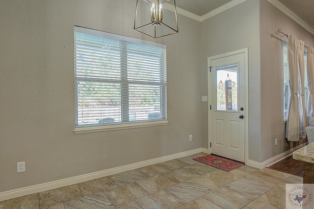 foyer with a healthy amount of sunlight and crown molding