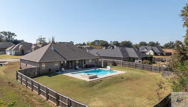 view of pool featuring a yard and a patio