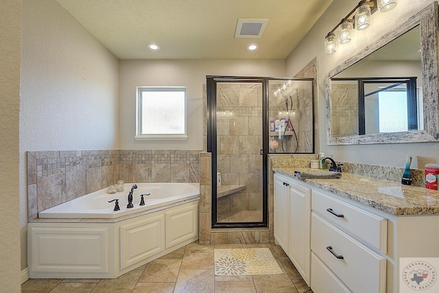 bathroom featuring separate shower and tub and vanity