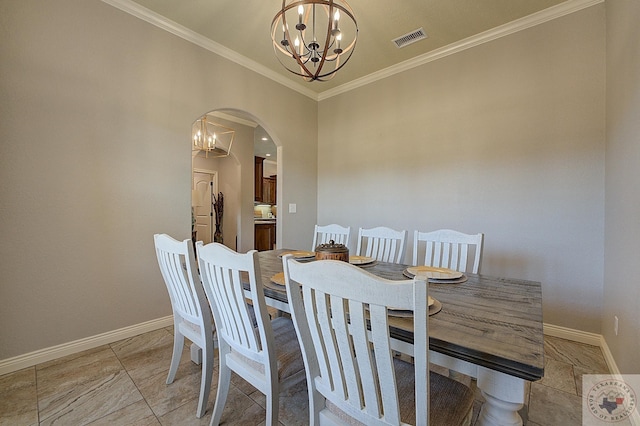 dining area with crown molding and an inviting chandelier