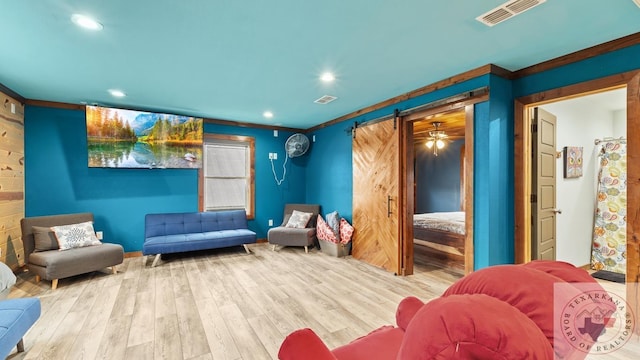 sitting room featuring wood finished floors, visible vents, and recessed lighting