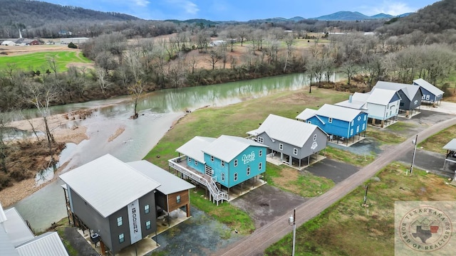 birds eye view of property featuring a water and mountain view