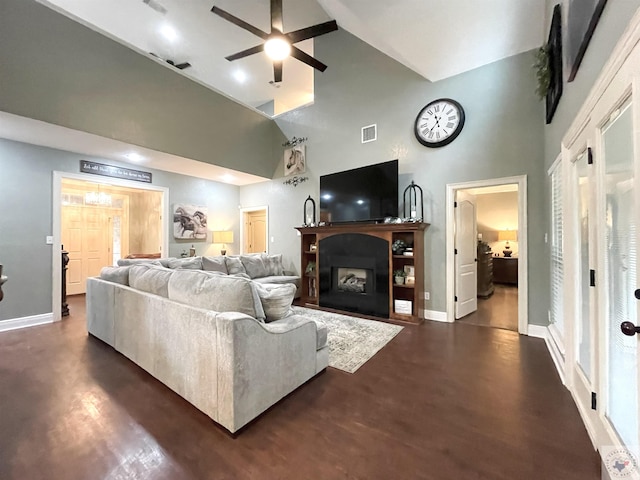 living room with high vaulted ceiling, ceiling fan, and dark hardwood / wood-style flooring