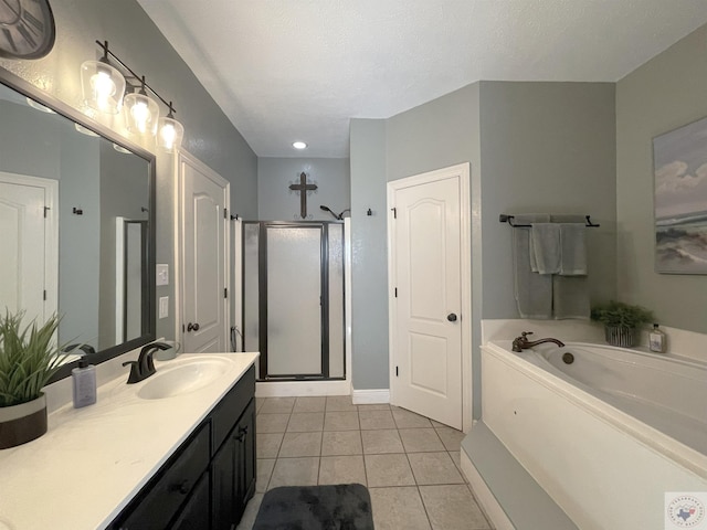 bathroom featuring a textured ceiling, tile patterned floors, vanity, and separate shower and tub