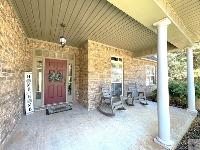 entrance to property featuring covered porch