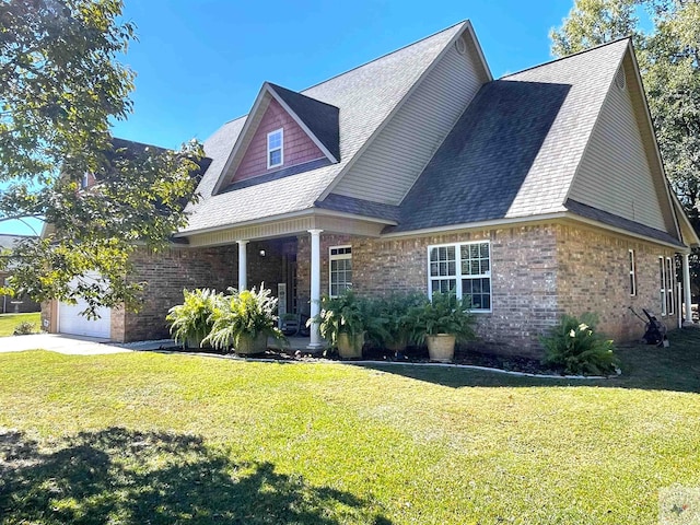 view of front of home with a garage and a front yard