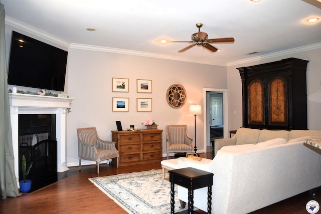 2905 Landon Ln, Texarkana, TX 75503 - living area featuring a ceiling fan, wood finished floors, ornamental molding, and a fireplace with flush hearth
