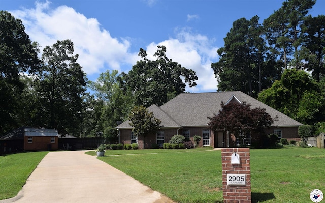 2905 Landon Ln, Texarkana, TX 75503 - view of front facade featuring a front yard, brick siding, concrete driveway, and roof with shingles