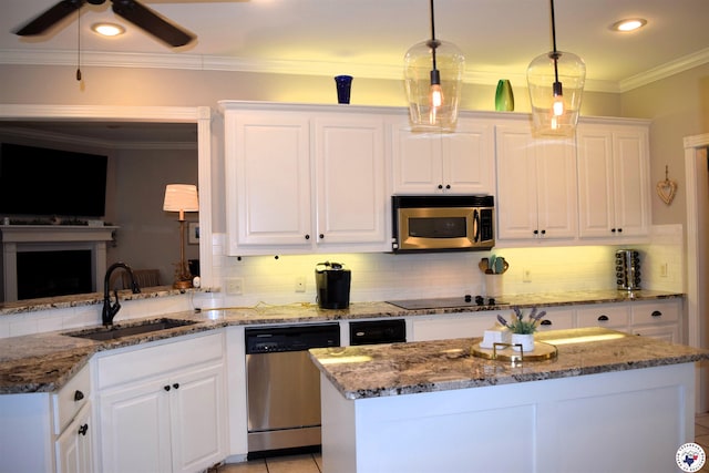 2905 Landon Ln, Texarkana, TX 75503 - kitchen featuring stainless steel appliances, decorative backsplash, white cabinetry, stone countertops, and crown molding