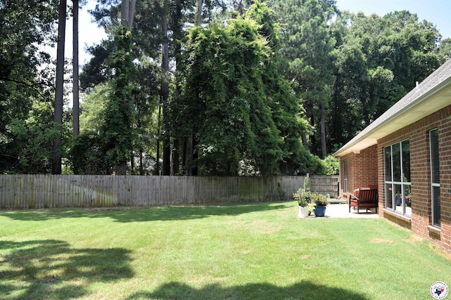 2905 Landon Ln, Texarkana, TX 75503 - fenced backyard with a patio
