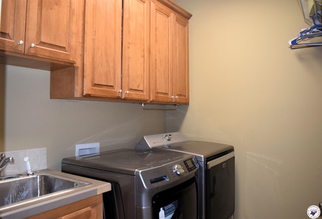2905 Landon Ln, Texarkana, TX 75503 - washroom with washer and dryer and cabinet space