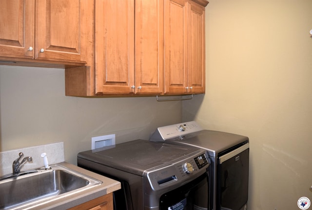 2905 Landon Ln, Texarkana, TX 75503 - laundry room featuring washer and clothes dryer and cabinet space