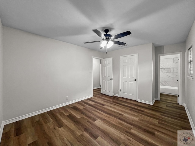 unfurnished bedroom featuring ceiling fan and dark hardwood / wood-style flooring