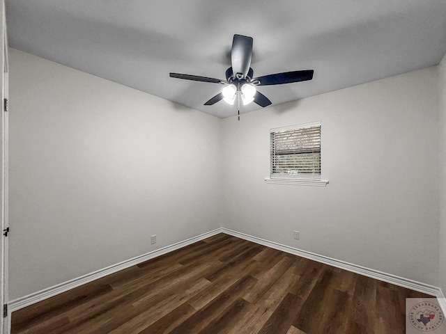 empty room with dark wood-type flooring and ceiling fan