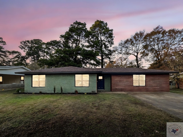 ranch-style house with a yard