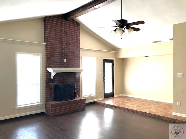 unfurnished living room with ceiling fan, dark wood-type flooring, vaulted ceiling with beams, and a fireplace