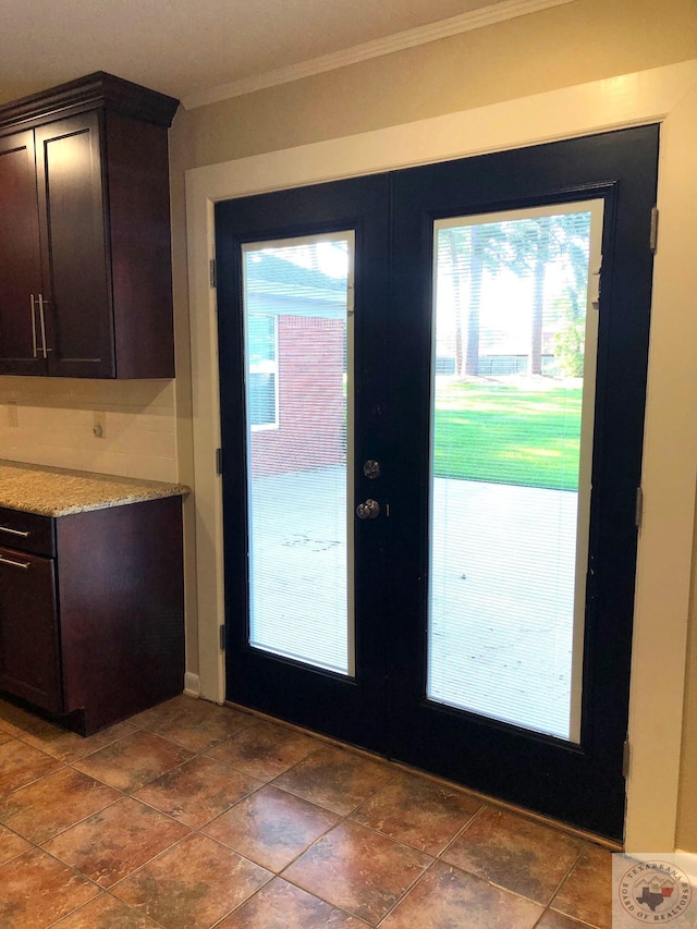 doorway to outside featuring ornamental molding and french doors