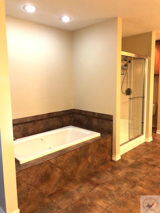 bathroom with toilet, independent shower and bath, and tile patterned flooring