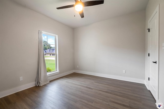8409 Mandarin Cv, Texarkana, TX 75503 - empty room with healthy amount of natural light, ceiling fan, and dark wood-type flooring