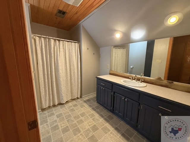 bathroom featuring vanity, lofted ceiling, and wood ceiling