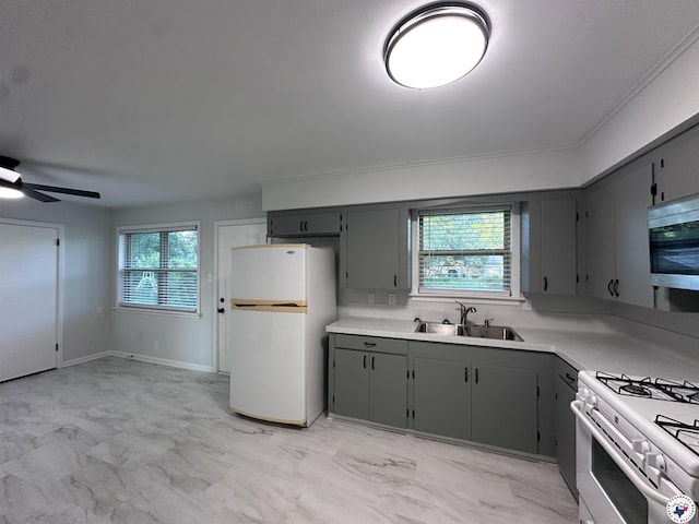 3706 Greenwood St, Texarkana, AR 71854 - kitchen with white appliances, a sink, gray cabinets, light marble finish floors, and healthy amount of natural light