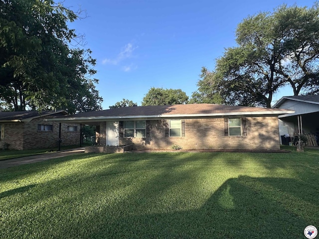 3706 Greenwood St, Texarkana, AR 71854 - rear view of house with a lawn, brick siding, and a carport