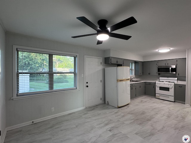 3706 Greenwood St, Texarkana, AR 71854 - kitchen featuring white appliances, gray cabinetry, light countertops, a ceiling fan, and crown molding