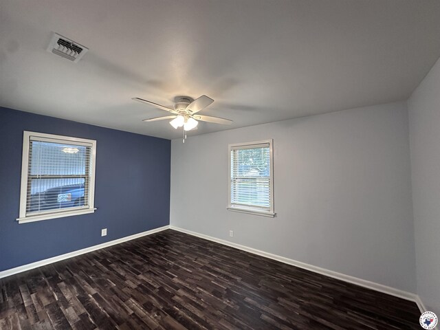 3706 Greenwood St, Texarkana, AR 71854 - unfurnished room featuring dark wood-type flooring, baseboards, and a ceiling fan